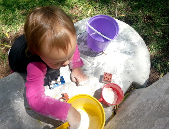 Fun with flour, a bucket and Duplo Blocks and
