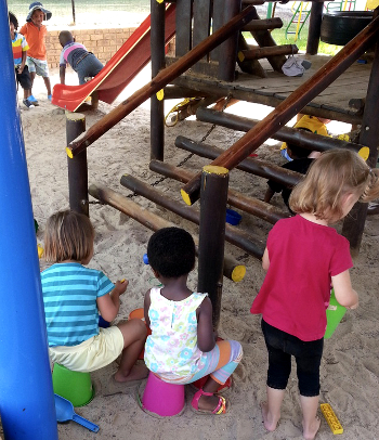 Playing 'school' in the sandpit